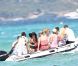 A bord d'un bateau pneumatique, Paris Hilton rejoint un yacht pour y passer la journée, à St-Tropez, le samedi 28 juillet 2012.