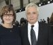 Michel Sardou et son épouse Anne-Marie Périer au défilé Chanel organisé au Grand Palais le 2 octobre 2012