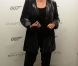 Judi Dench lors de la vente aux enchères d'objets de la saga James Bond donnés par les acteurs de la franchise, chez Christie's, à Londres, le 5 octobre 2012