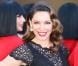 Kelly Brook, craquante dans sa robe noire en dentelle Jacques Azagury, se présente comme nouvelle membre par intérim de la troupe du Crazy Horse. Londres, le 16 octobre 2012.