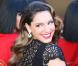 Kelly Brook, craquante dans sa robe noire en dentelle Jacques Azagury, se présente comme nouvelle membre par intérim de la troupe du Crazy Horse. Londres, le 16 octobre 2012.