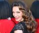 Kelly Brook, habillée d'une robe Jacques Azagury et de souliers Jimmy Choo lors de sa présentation comme nouvelle danseuse du Crazy Horse. Londres, le 16 octobre 2012.
