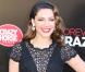 Kelly Brook, habillée d'une robe Jacques Azagury et de souliers Jimmy Choo lors de sa présentation comme nouvelle danseuse du Crazy Horse. Londres, le 16 octobre 2012.