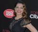 Kelly Brook, habillée d'une robe Jacques Azagury et de souliers Jimmy Choo lors de sa présentation comme nouvelle danseuse du Crazy Horse. Londres, le 16 octobre 2012.