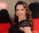 Kelly Brook, habillée d'une robe Jacques Azagury et de souliers Jimmy Choo lors de sa présentation comme nouvelle danseuse du Crazy Horse. Londres, le 16 octobre 2012.