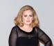 Adele pose lors des Brits Awards en février 2012 à Londres