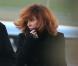 La chanteuse Mylène Farmer et son staff arrivent en jet privé à l'aéroport de Cannes-Mandelieu pour assister aux NRJ Music Awards, le 25 janvier 2013.