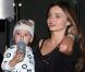 Miranda Kerr et son fils Flynn à l'aéroport de Los Angeles, le 26 janvier 2013.