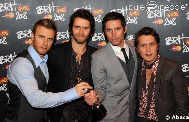 Le groupe Take That à 4 : Gary Barlow, Howard Donald, Jason Orange et Mark Owen 