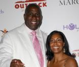 Magic Johnson et sa femme Cookie Kelly lors de la soirée de charité pour la fondation HollyRod à Los Angeles le 25 juillet 2009