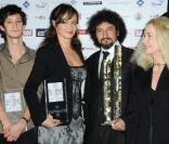 Pierre Niney, Julie Ferrier, Radu Mihaileanu et Brigitte Fossey lors de la remise du prix Cinéma Patrimoine de Paris, le 5 décembre à l'Automobile Club de France, à Paris.