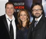 John Travolta, Kelly Preston et Pierre Morel à l\'occasion de l\'avant-première de <i>From Paris with Love</i>, à l\'UGC Normandie, sur les Champs-Elysées, à Paris, le 11 février 2010.