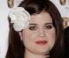 La métamorphose de Kelly Osbourne : Le 20 mai 2007, Kelly est très ronde et sa fleur dans les cheveux lui donne un petit air ridicule !