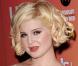 La métamorphose de Kelly Osbourne : En avril 2006, Kelly semble avoir perdu un peu de poids (et de poitrine) et affiche son joli minois !