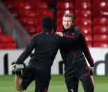 David Beckham à l'entrainement avec le Milan AC dans le stade d'Old Trafford avant son match de Ligue des Champions face à son ancien club de Manchester United.