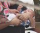 Kourtney Kardashian et son fils Mason à Miami le 13 mars 2010