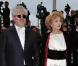 Pedro Almodovar et Maria Luisa Parades sur le tapis rouge du Festival de Cannes, avant la projection de You Will Meet A Tall Dark Stranger, de Woody Allen, le 15 mai 2010