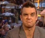 Robbie Williams a montré ses fesses durant une émission télévisée danoise pour 23 euros, le 2 décembre 2010, à Copenhague