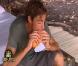 A pleine bouche, Claude déguste son sandwich au camembert.