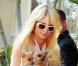 Paris Hilton ne cache plus ses rondeurs... Ces clichés l'illustrant avec ses chihuahuas à Los Angeles, le dimanche 23 janvier, font quasiment office de preuve.
