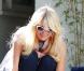 Paris Hilton ne cache plus ses rondeurs... Ces clichés l'illustrant avec ses chihuahuas à Los Angeles, le dimanche 23 janvier, font quasiment office de preuve.