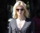 January Jones, une gravure de mode... même pour sortir les poubelles, à Los Angeles, le 4 février 2011.