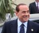 Carlita, enceinte, et Nicolas Sarkozy accueillent Silvio Berlusconi au Ciro's, à Deauville. 