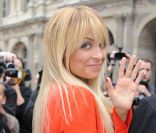 Nicole Richie et son mari Joel Madden, à l\'entrée du défilé Louis Vuitton printemps-été 2012. Paris, le 5 octobre 2011.<br />