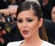 Cheryl Cole, la bouche en coeur, dévoile sa nouvelle création