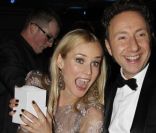 Diane Kruger et Stéphane Bern au Dîner de la mode pour le Sida au Pavillon d'Armenonville à Paris, le 26 janvier 2012.