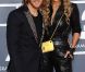 David et Cathy sur le tapis rouge de la cérémonie des 54e Grammy Awards au Staples Center de Los Angeles le 12 février 2012. Les stars étaient nombreuses à être venues accompagnées pour la grand-messe des récompenses musicales américaines.