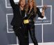 David et Cathy sur le tapis rouge de la cérémonie des 54e Grammy Awards au Staples Center de Los Angeles le 12 février 2012. Les stars étaient nombreuses à être venues accompagnées pour la grand-messe des récompenses musicales américaines.