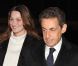 Nicolas Sarkozy et Carla Bruni arrivent, souriants, dans les locaux de TF1, à Paris, le 15 février 2012.