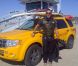 Jean-Roch à Los Angeles devant une voiture des LifeGuard sur Venice Beach le 14 février 2012