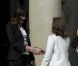 Carla Bruni-Sarkozy et Valérie Trierweiler sur le perron de l'Elysée lors de la passation de pouvoir entre Nicolas Sarkozy et François Hollande, le 15 mai 2012.