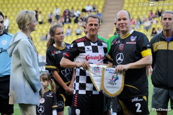 Albert de Monaco, la princesse Charlène et Michael Schumacher le 22 mai 2012 à Monaco pour un match de charité organisé au profit de l'association de la princesse Charlène