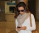 Eva Longoria arrive à l'aéroport de Miami le 3 août 2012 après avoir assisté à l'enterrement de son amie Lupe Ontiveros