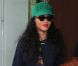 Rihanna, habillée d'un minishort et de bottines Chloë Sevigny pour Opening Ceremony et d'un pull Kenzo, une casquette de la même marque sur la tête, sort de son hôtel londonien. Le 28 août 2012.