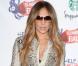 Jennifer Lopez en chemisier Chloé et bottes Christian Louboutin à Wembley lors du Capital FM Summertime Ball. Londres, le 12 juin 2011.