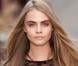 Cara Delevingne lors du défilé Burberry Prorsum automne-hiver 2013-2014 à Londres. Le 18 février 2013.