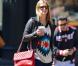 Nicky Hilton dans les rues de New York, porte un sac matelassé rouge Chanel et des baskets Isabel Marant. Le 25 avril 2013.