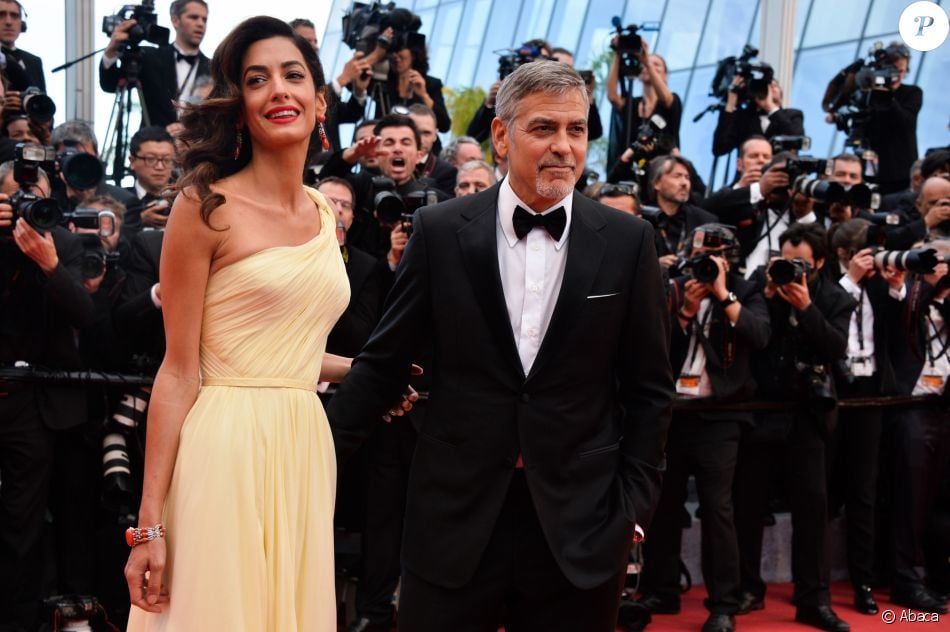 George Clooney et son épouse Amal Clooney sur le tapis rouge du Festival de Cannes le 12 mai 2016