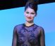 Laetitia Casta rend hommage à Yves Saint Laurent en portant l'une de ses créations audacieuses et transparentes lors des César 2010 