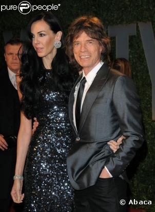 Mick Jagger et sa compagne L'Wren posent à la soirée Vanity-Fair (soirée post-Oscars)