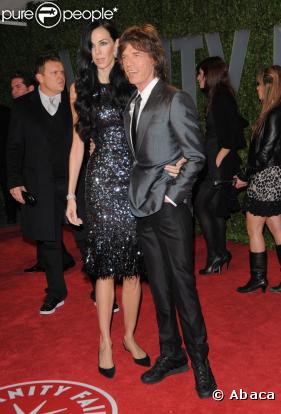 Mick Jagger et sa compagne L'Wren posent à la soirée Vanity-Fair (soirée post-Oscars)
