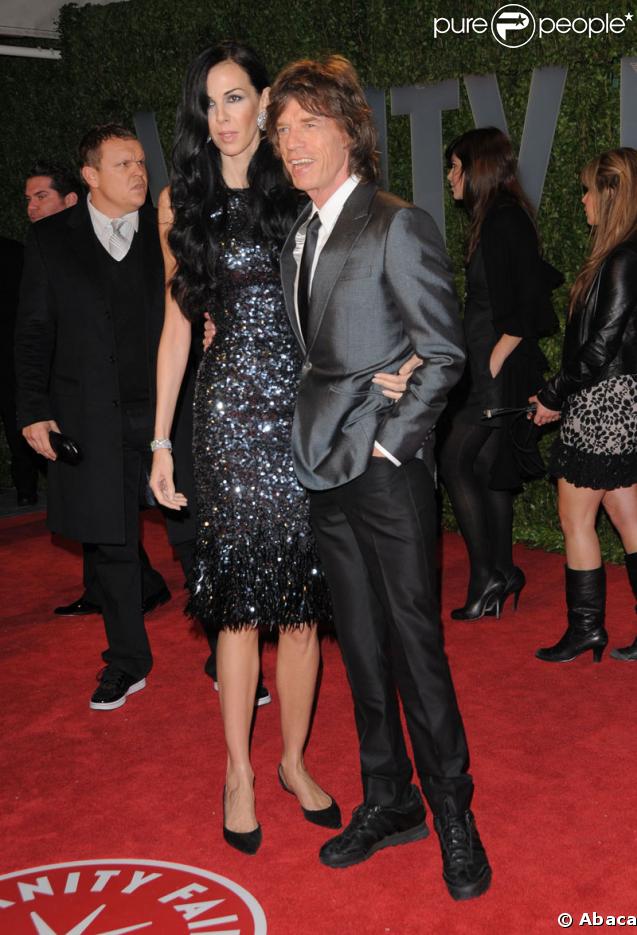 Mick Jagger et sa compagne L'Wren posent à la soirée Vanity-Fair (soirée post-Oscars)