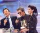 Alain Bashung aux Victoires de la Musique aux côtés de Michel Drucker et Emma Shapplin en février 1999 
