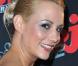 Une appétissante Elodie Gossuin, en bustier et jupe rose-bonbon, lors du quatrième anniversaire de la chaîne de la TNT NRJ 12, qui s'est tenue le 18 mars 2009 au VIP Room Theatre, à Paris.