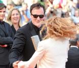 Quentin Tarantino et Mélanie Laurent lors de la montée des marches avant la projection d'Inglourious Basterds, au Festival de Cannes, le 20 mai 2009