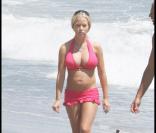 Kendra Wilkinson et son mari Hank Baskett, sur la plage de Malibu, en Californie, le 20 juillet 2009 !